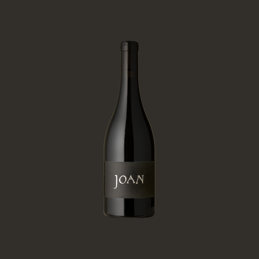 Wine bottle with 'JOAN' label on a dark background Pinot Noir Adelaide HIlls