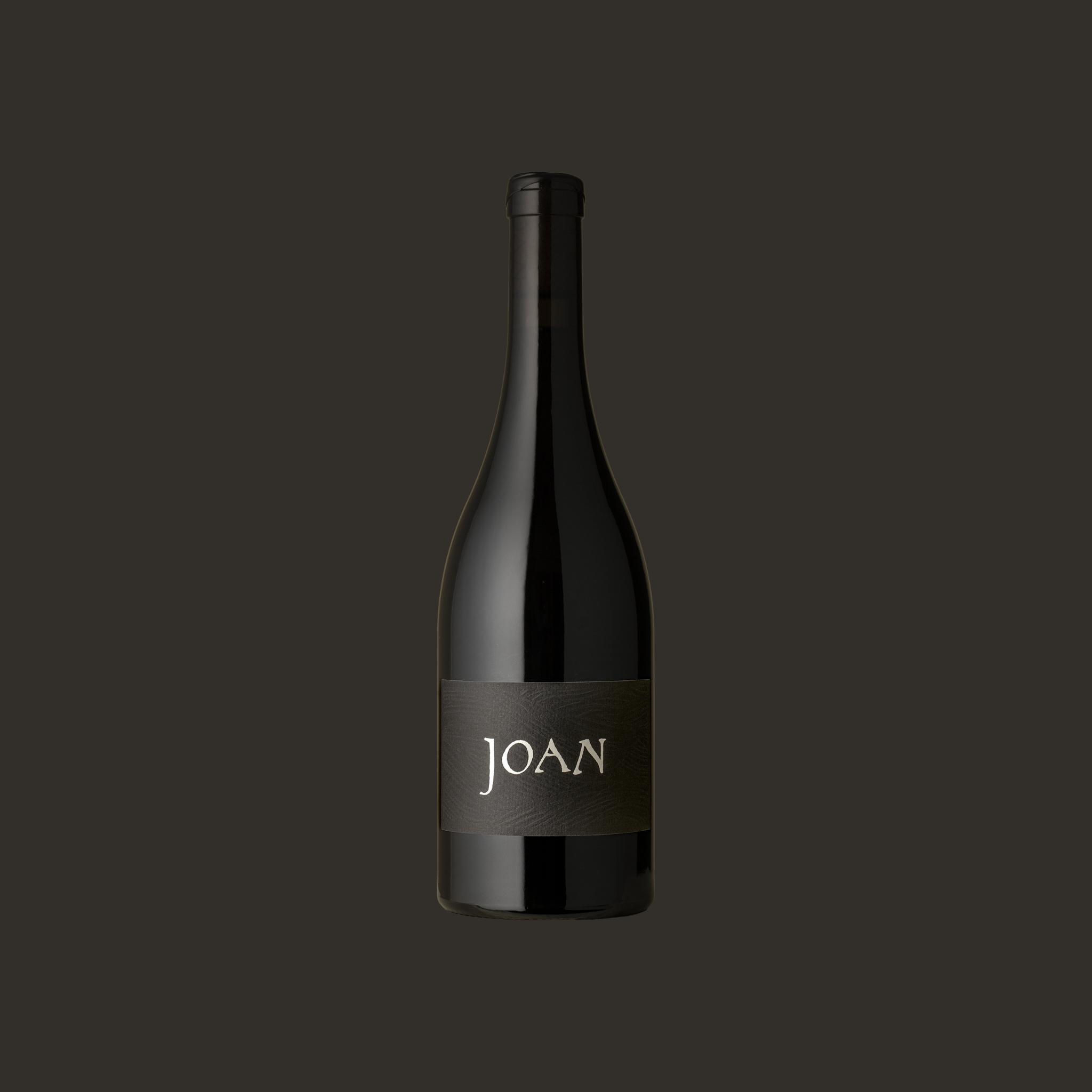 Wine bottle with 'JOAN' label on a dark background Pinot Noir Adelaide HIlls