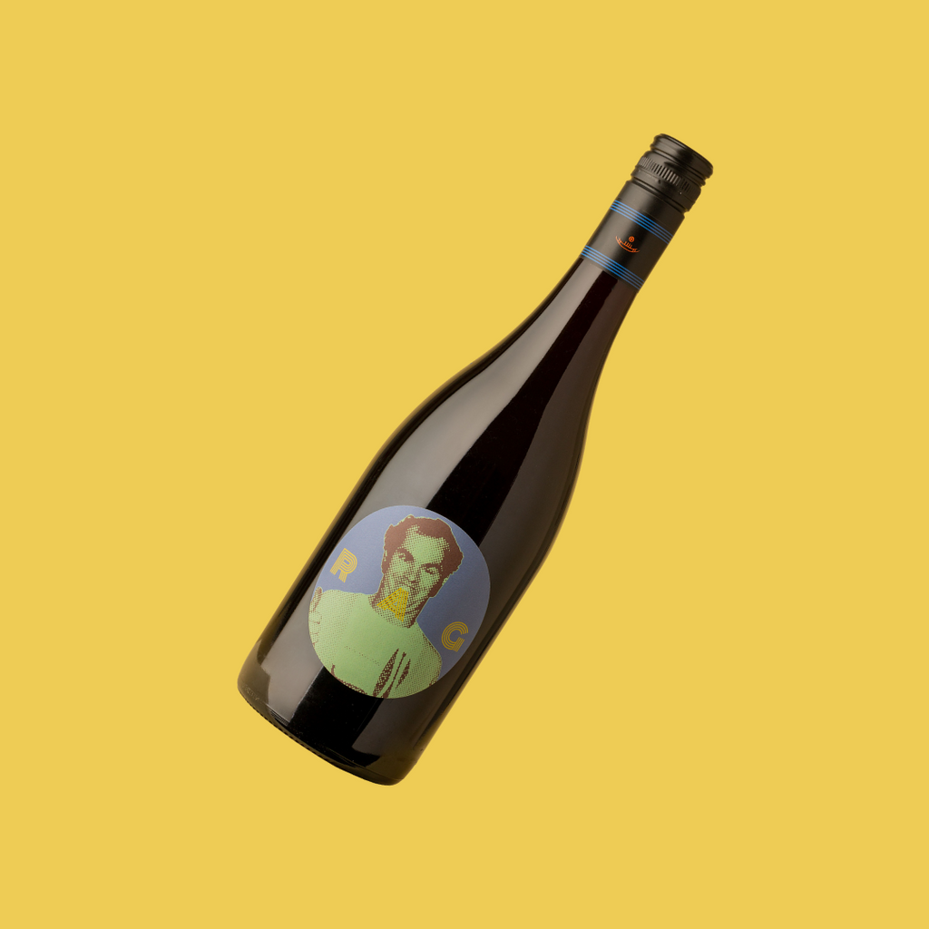 A bottle of 2023 RAG Red Blend wine with a label featuring a portrait illustration.