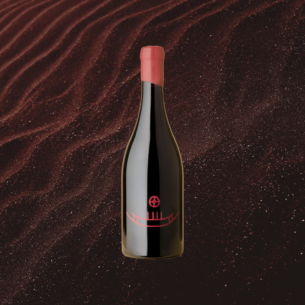 A bottle of 2021 Sigurd Reserve Syrah wine positioned against a backdrop with a red, wavy texture, indicative of the wine's flavor profile.